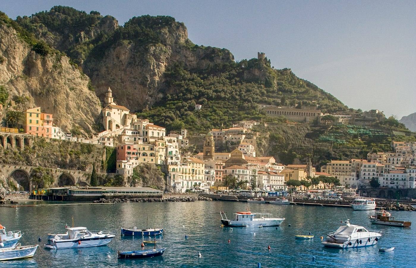 Colorful houses and boats in an Amalfi Coast harbor