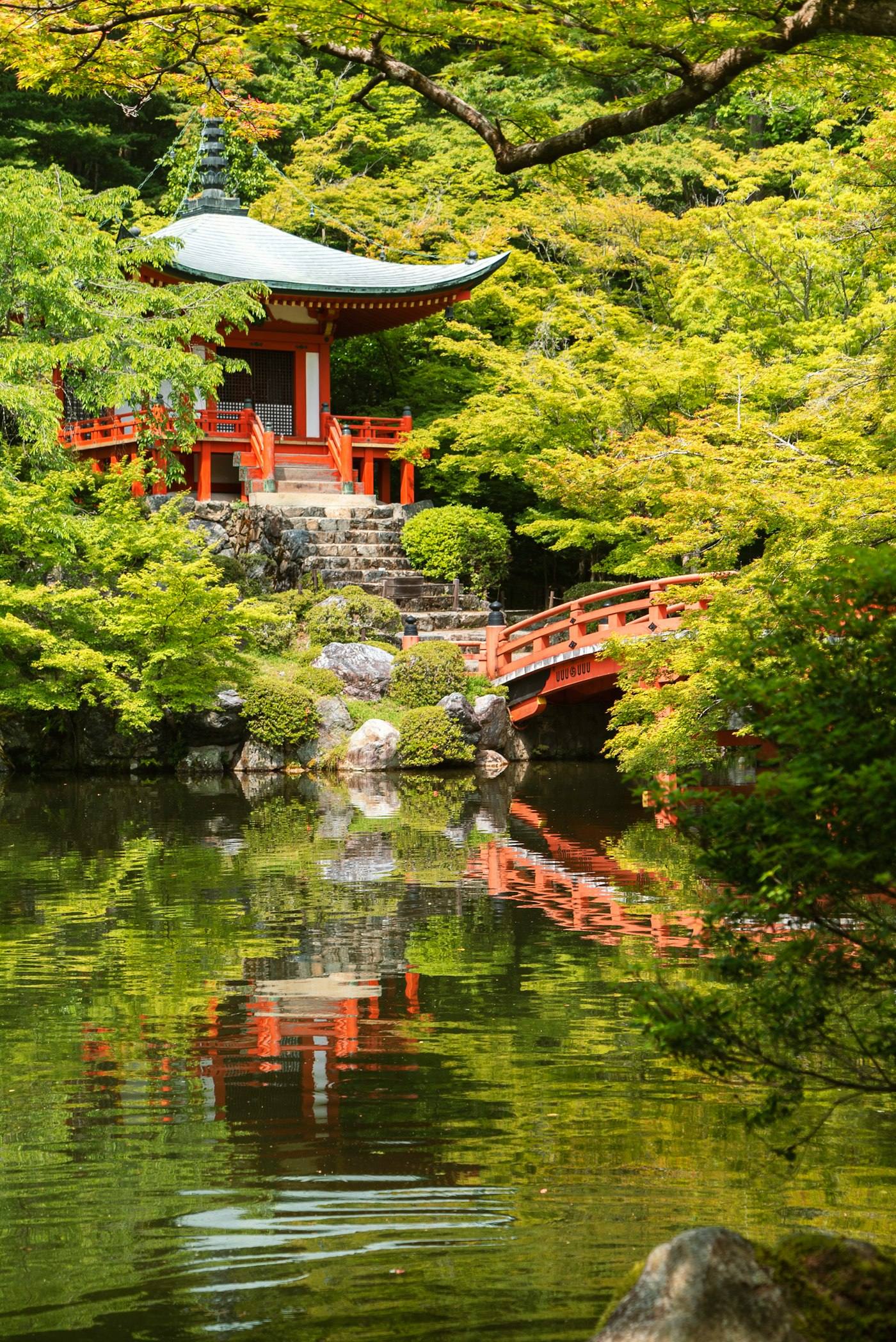 Red temple beside the water in Kyoto, Japan