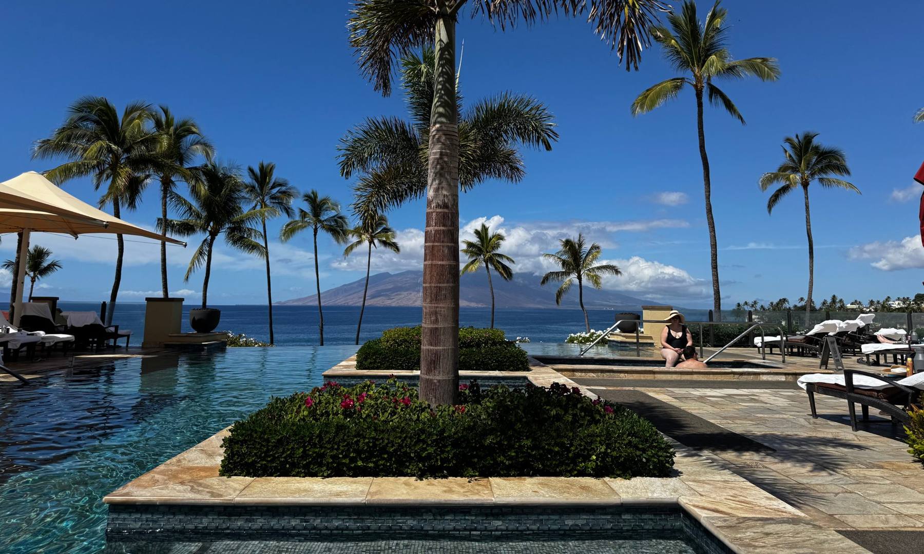 Palm-lined infinity pool at Four Seasons Maui